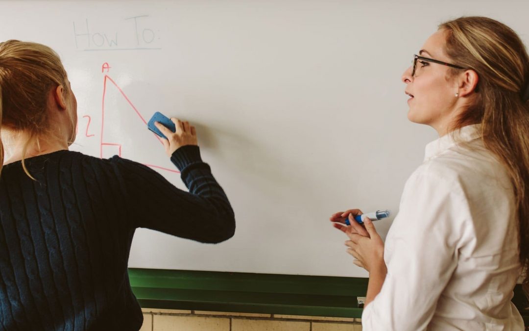 Student and teacher at the whiteboard